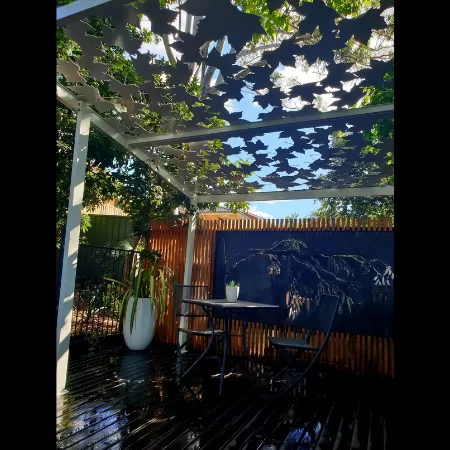 Pergola with Autumn Leaf Pattern in White Powder Coated Aluminium