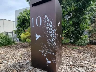 Medium Letterbox in Powder Coated aluminium. Grevillea with Bees pattern.